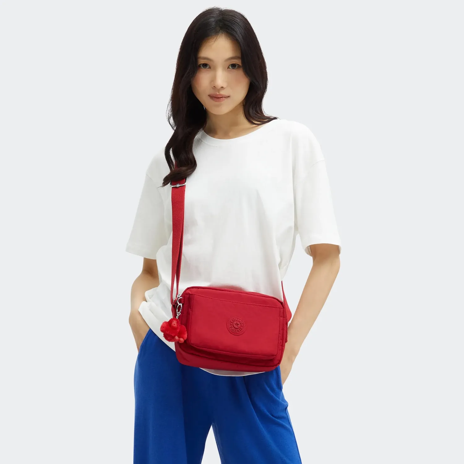 Kipling Abanu M crossbody tas Ruby Red medium met ritsvakken