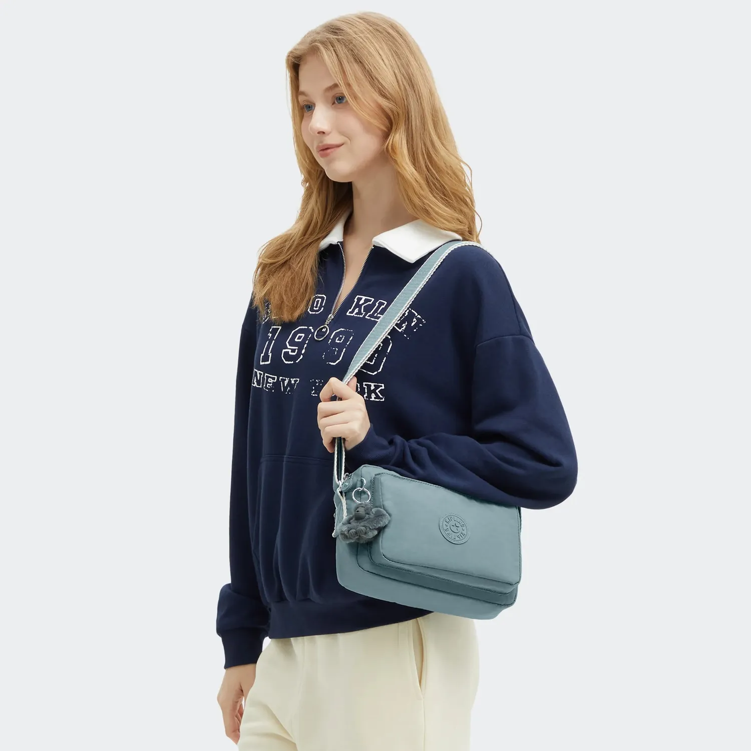 Kipling Abanu M crossbody tas Relaxed Grey Medium dubbel vak