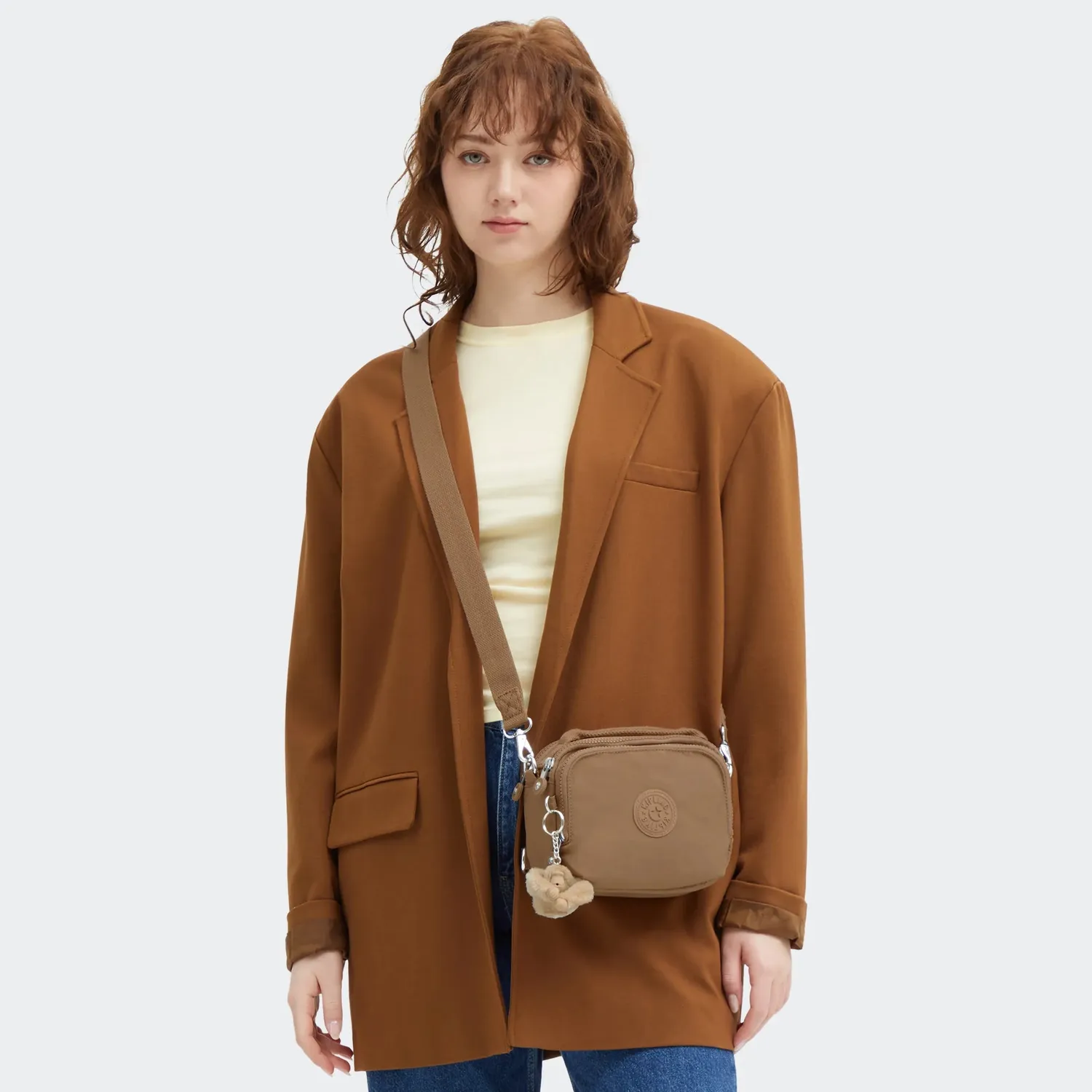 Kipling Cahir crossbody klein Early Tan met voorvak