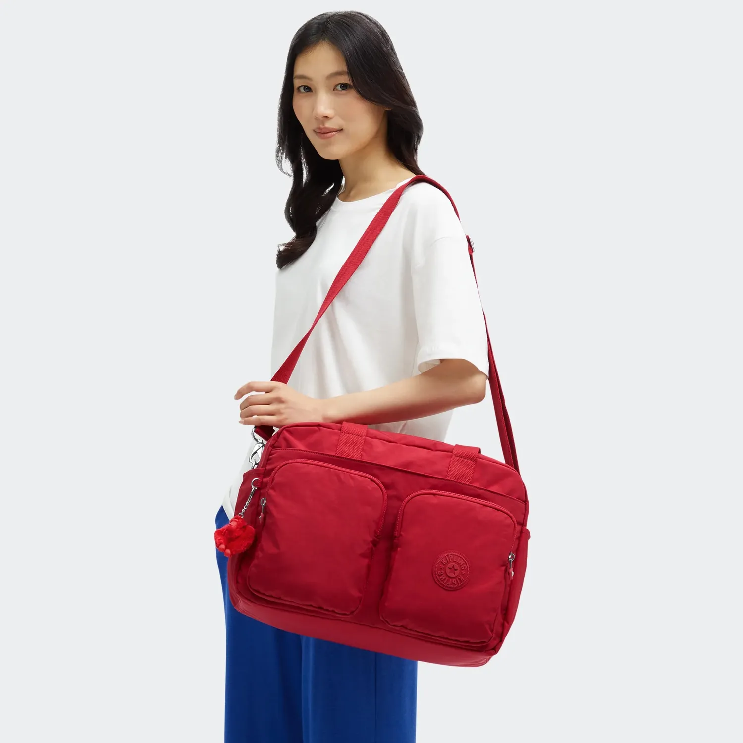 Kipling Defea XL weekendtas Medium Ruby Red met laptopvak