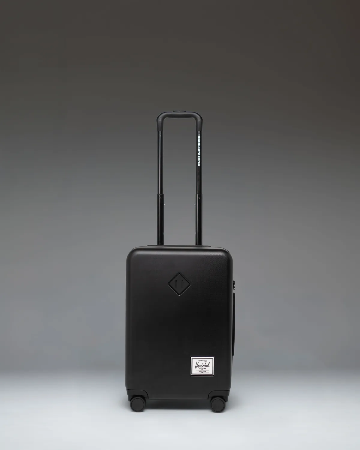 Herschel Heritage Hardshell koffer zwart large carry-on