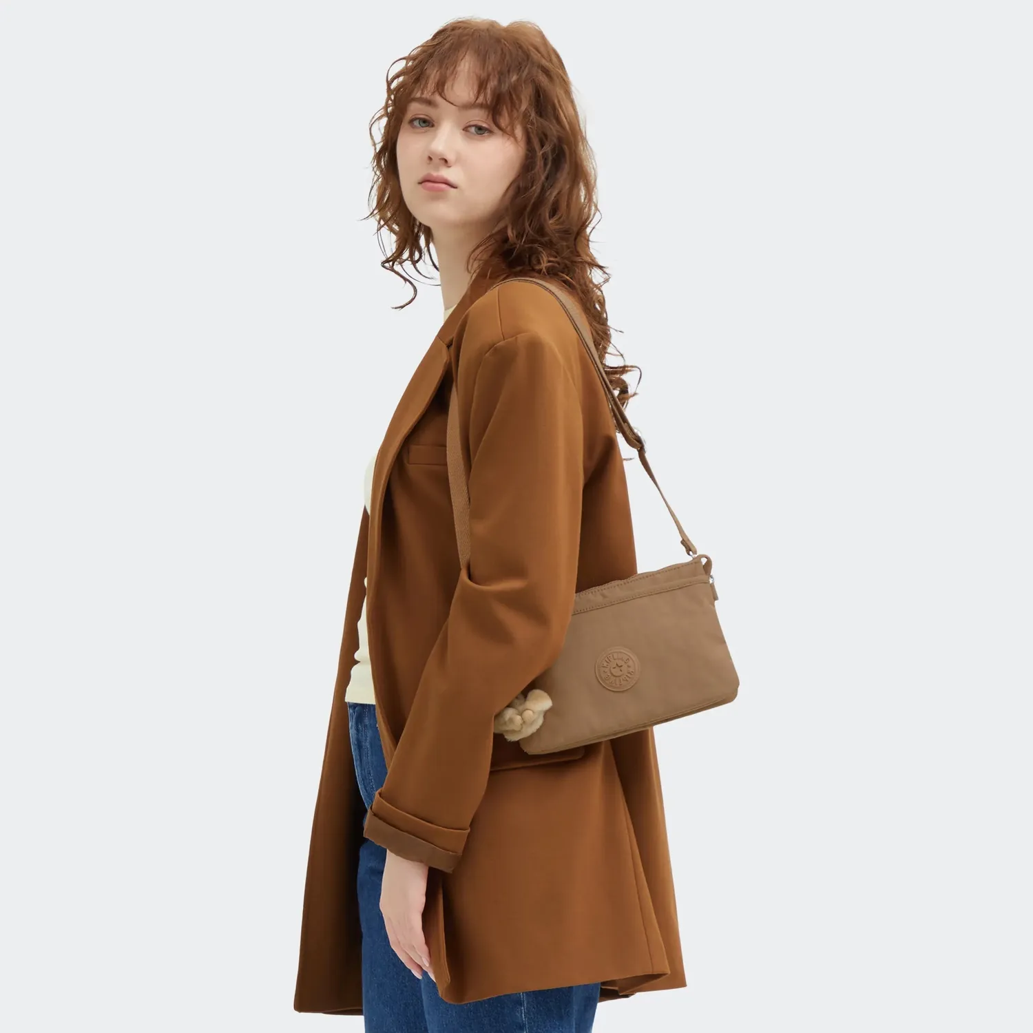 Kipling Riri crossbodytas Klein Early Tan lichtgewicht
