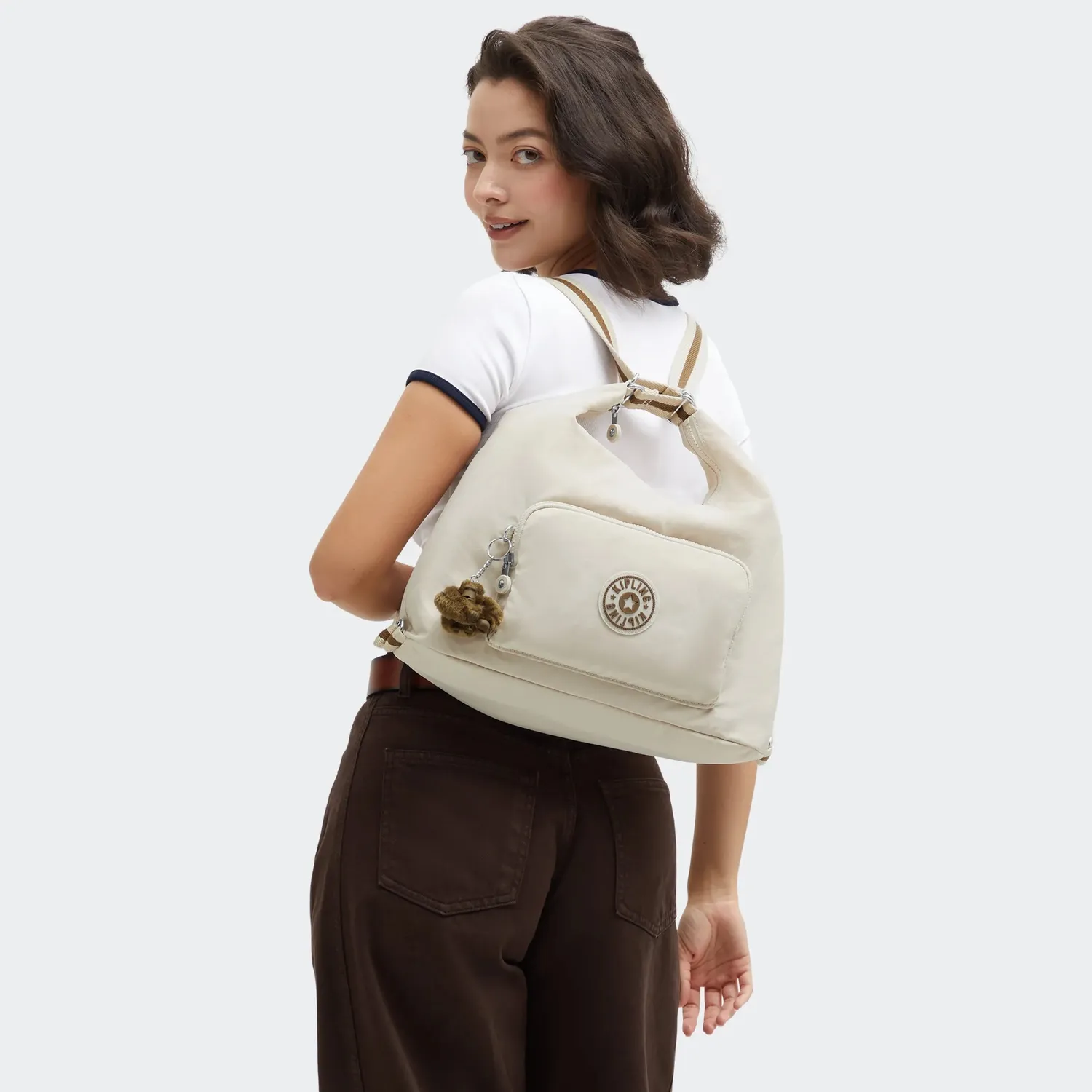 Kipling Yenna schoudertas Soft Sand medium multifunctioneel