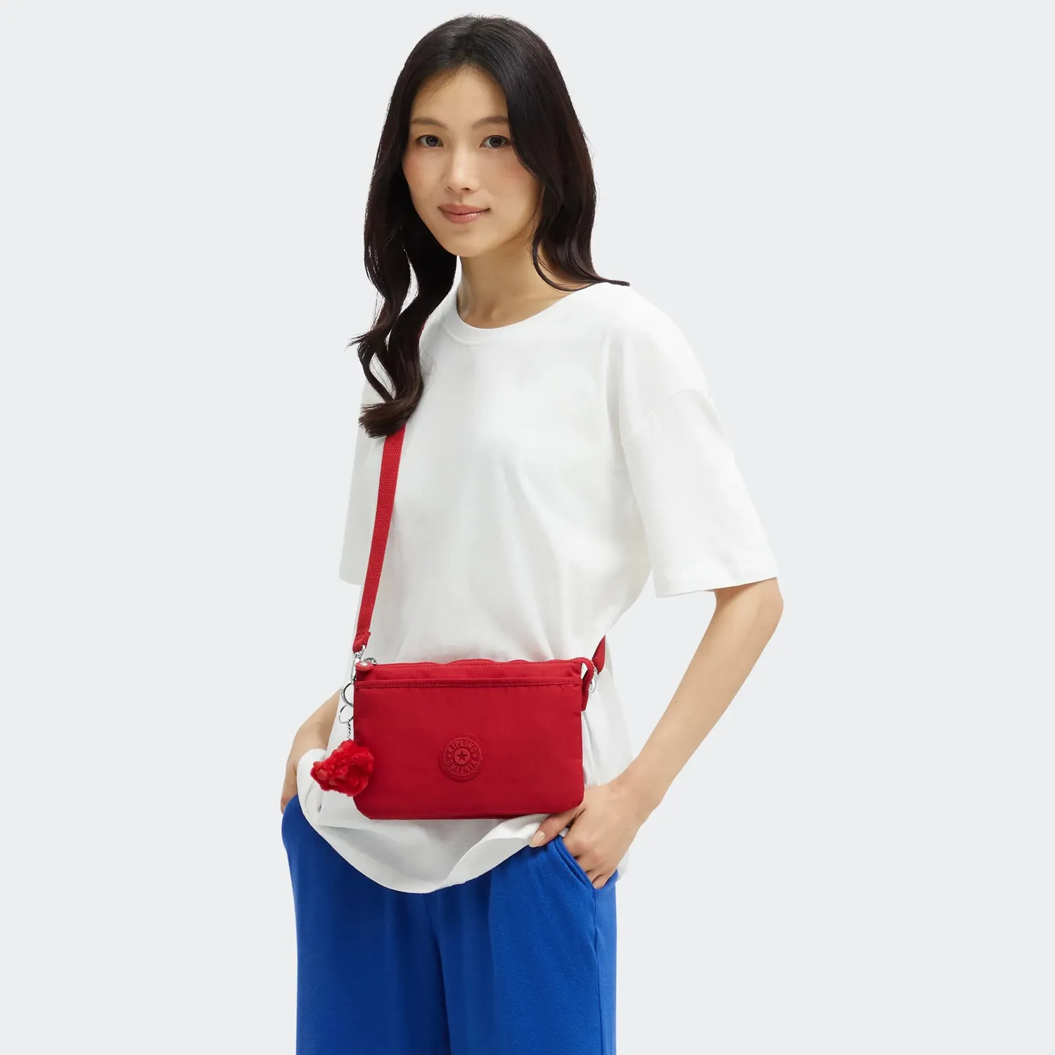 Kipling Riri crossbodytas klein Ruby Red waterafstotend