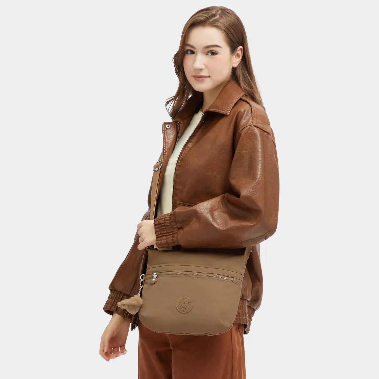 Kipling Arto schoudertas Medium Early Tan waterafstotend