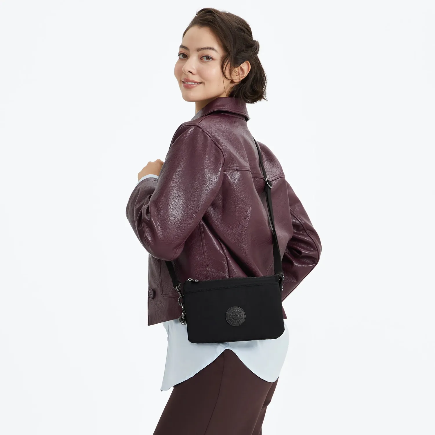 Kipling Riri crossbodytas klein Infinite Black waterafstotend